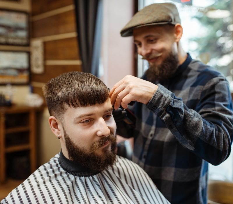 barber-in-hat-cuts-the-client-39-s-hair-barbershop.jpg