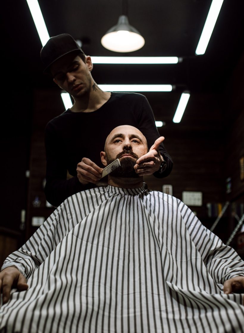the-stylish-barbershop-the-fashion-barber-tidies-up-beard-of-brutal-man-sitting-in-the-armchair-1.jpg
