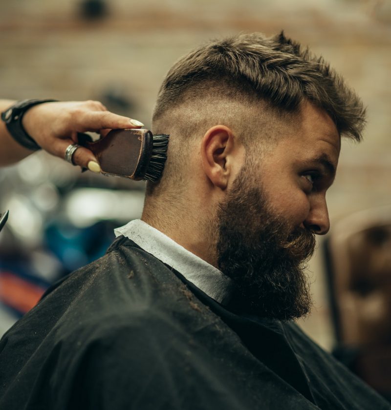young-bearded-man-getting-haircut-by-hairdresser-11.jpg